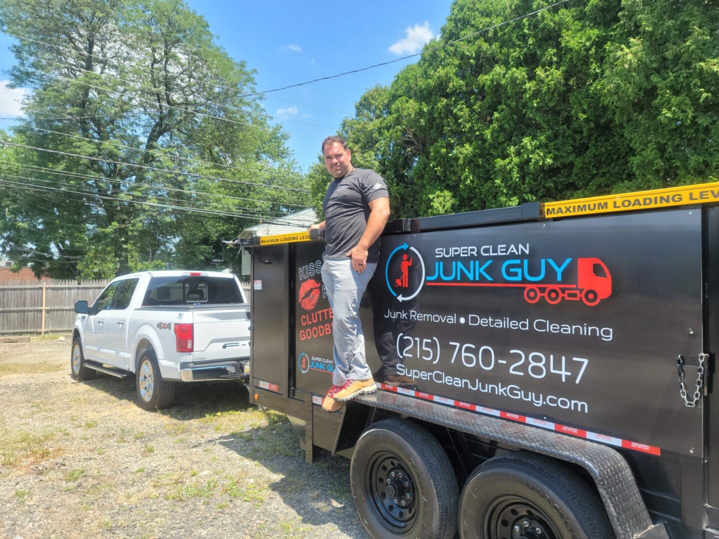A Man Standing on a Truck for Junk