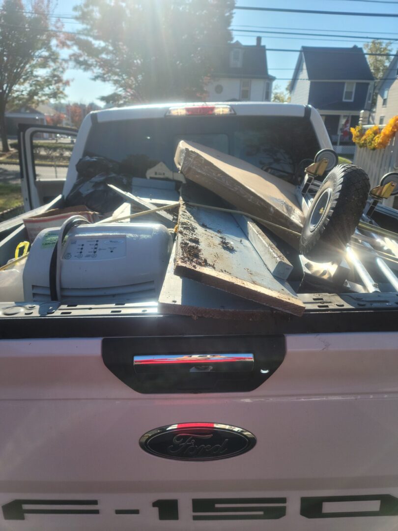 A pickup truck filled with different items