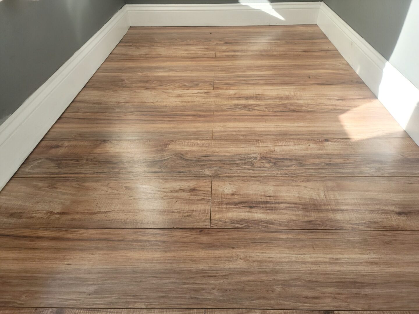 The wooden floor of an empty room