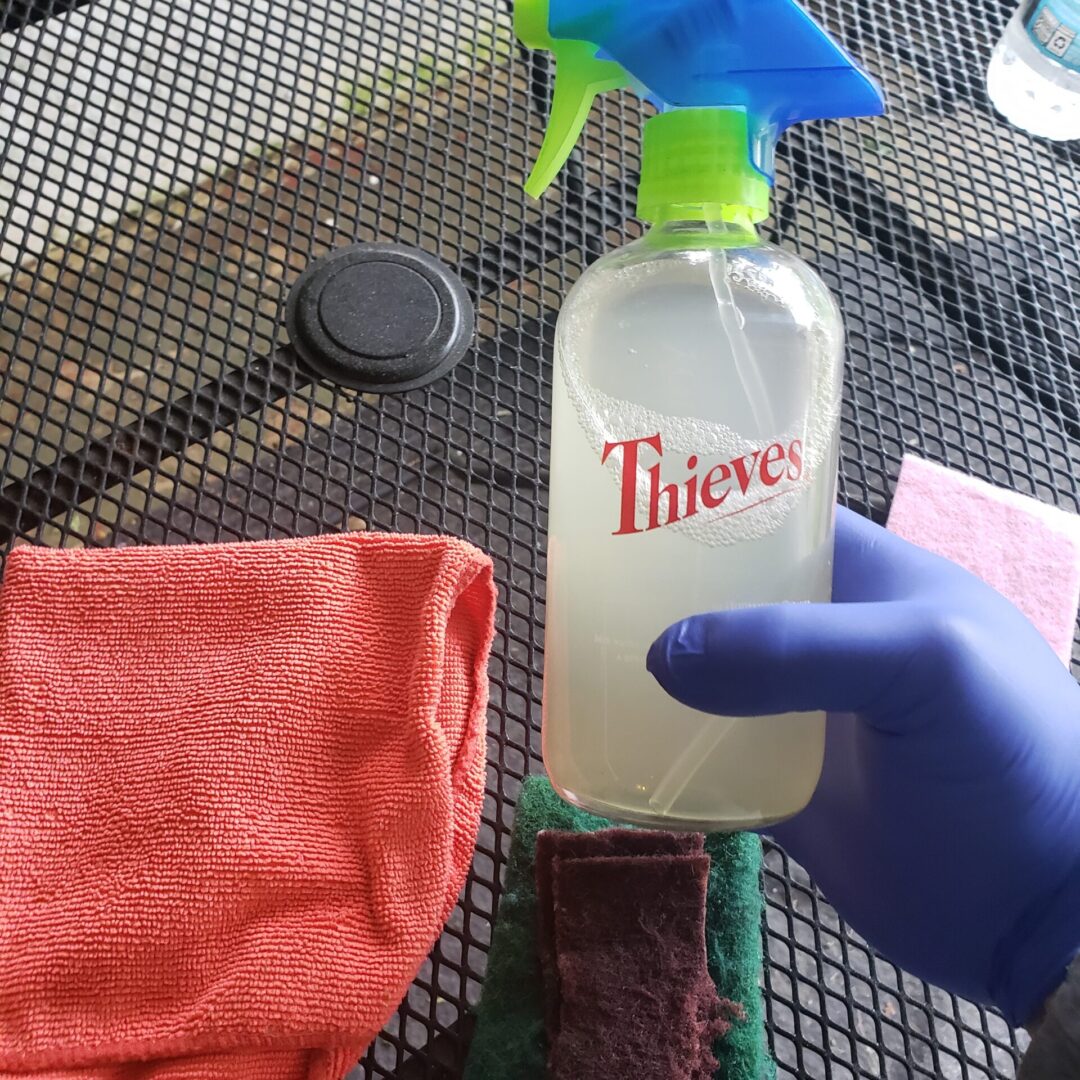 A person using cleaning liquids to clean