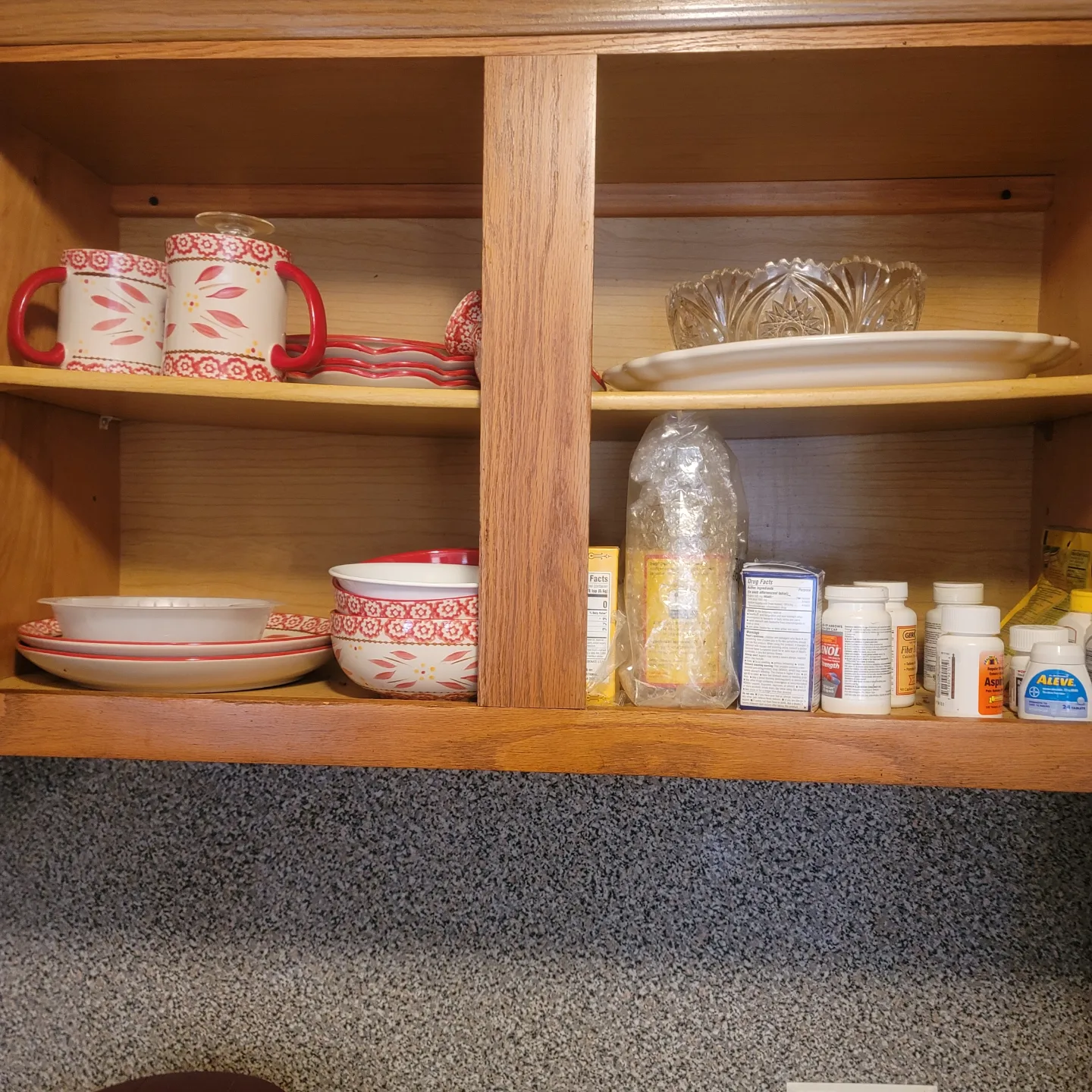 A cabinet with kitchen items and food products