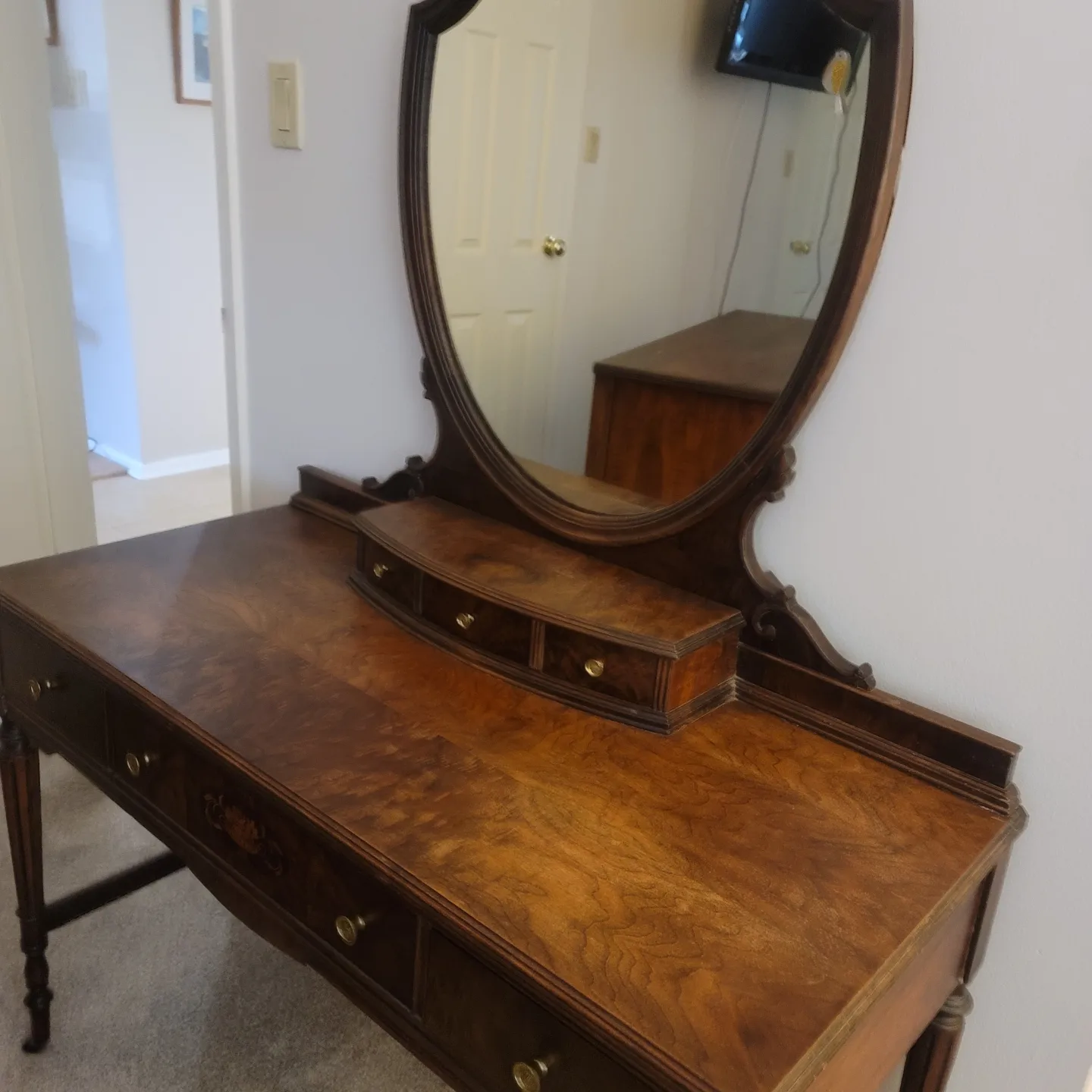 A Mirror Dresser With Four Drawers