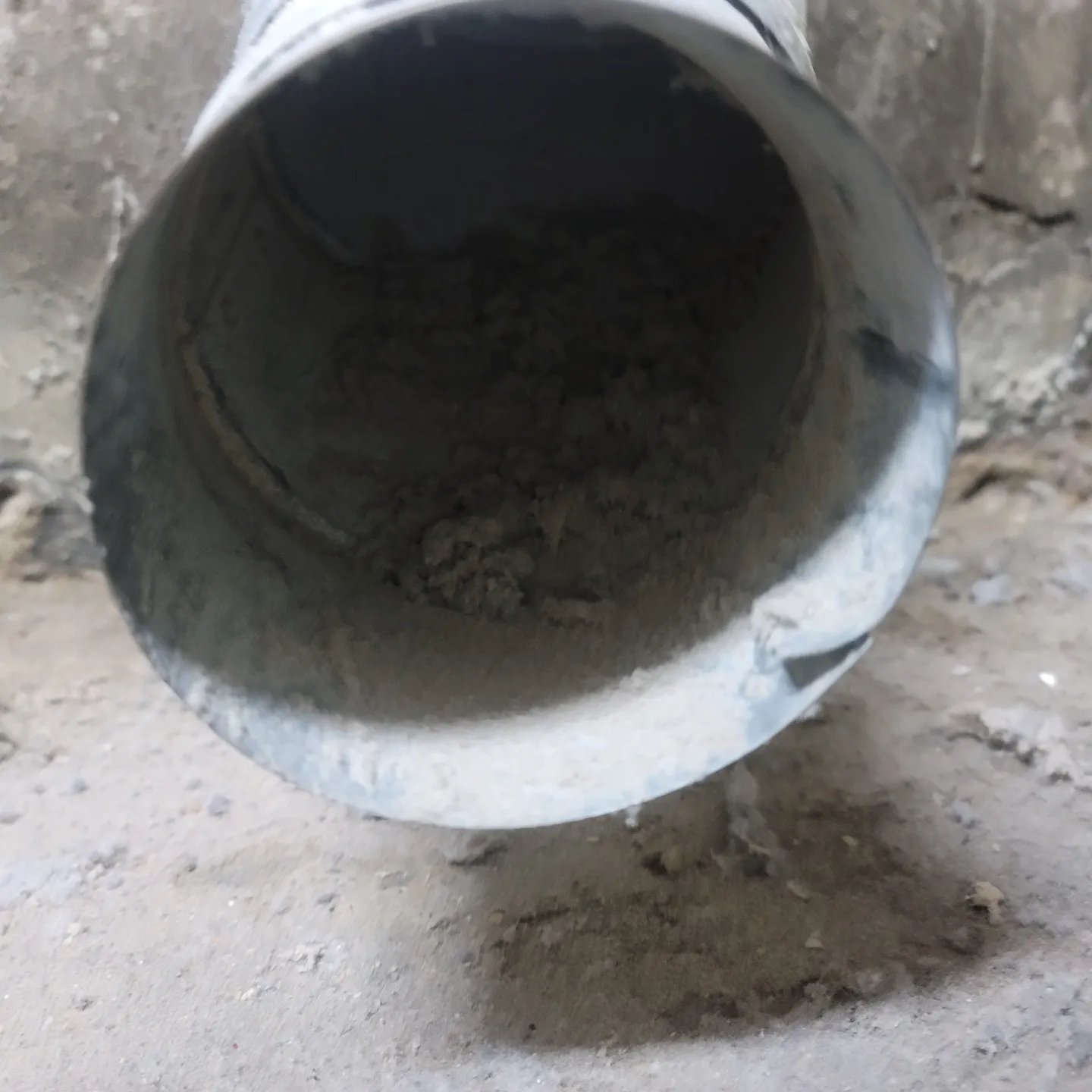 The Dirt Inside a Grey Large Pipeline